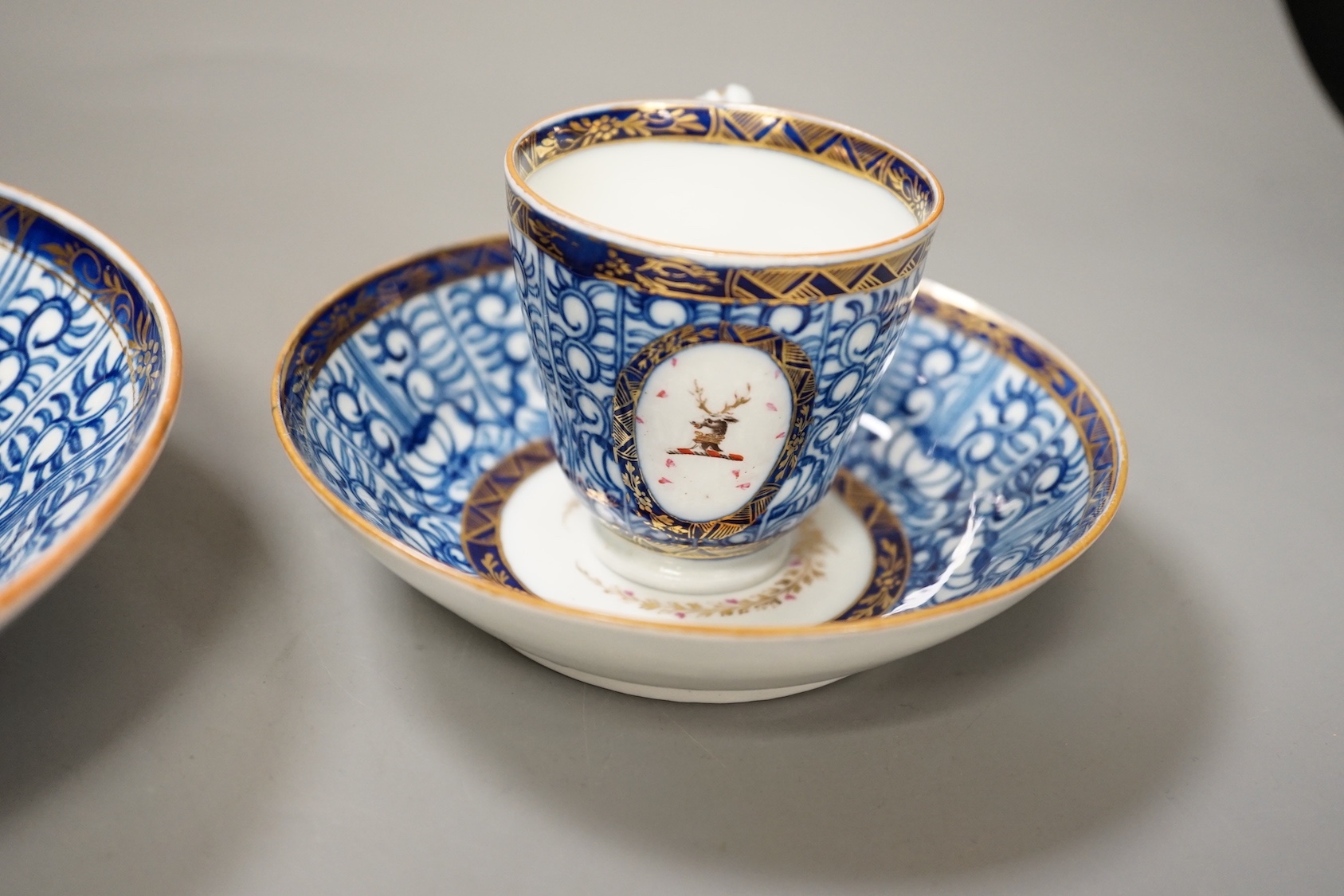 Chamberlains Worcester Armorial teawares, coffee cup, teacup and saucer and a saucer shaped dish, centres with the crest of a stag